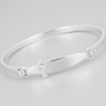 A silver plated bracelet with a christening cross design