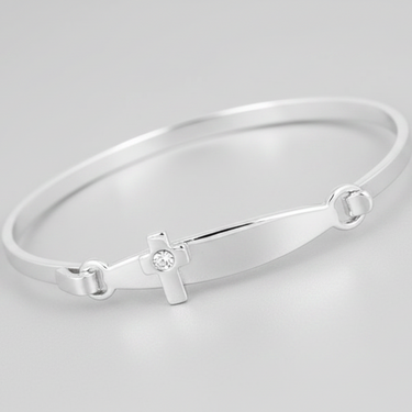 A silver plated bracelet with a christening cross design