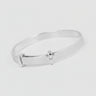 Silver bracelet with a small diamond on a dark surface